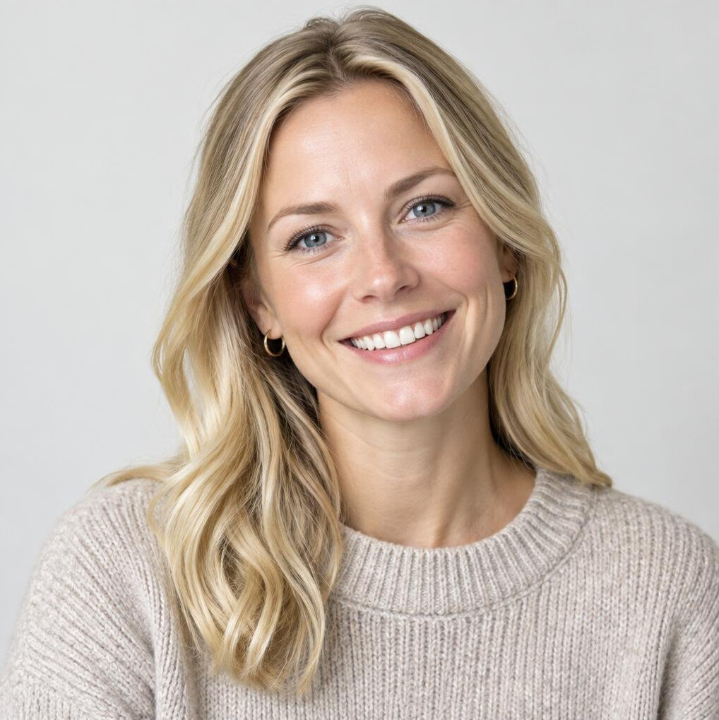 Norwegian woman with blonde hair smiling, studio portrait